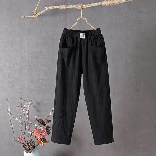 Straight-cut trousers with an elastic waistband and a simple design